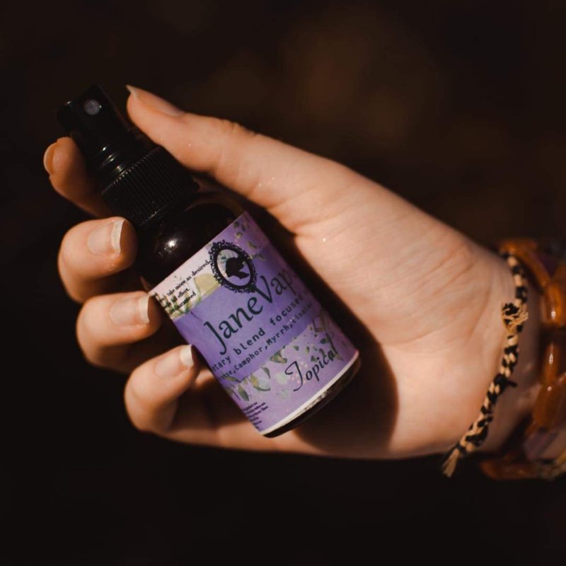 JaneVape topical spray in hand